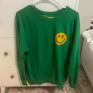 green aviator nation with smiley face